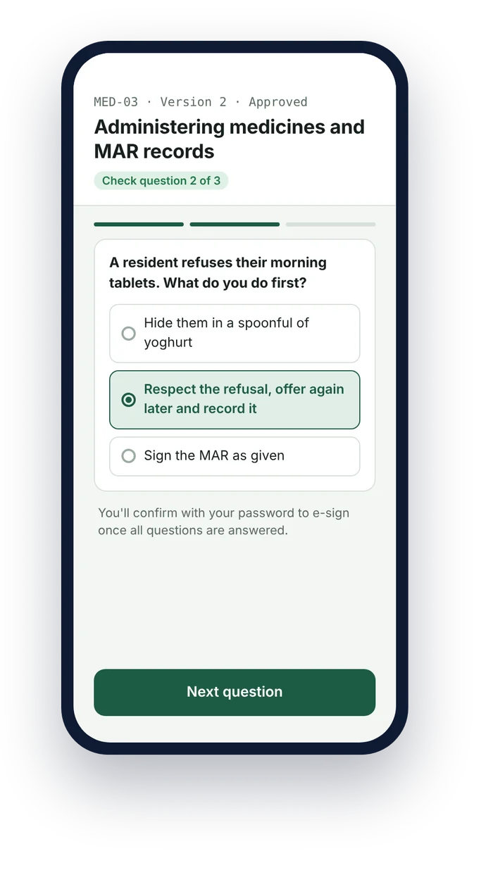 A care worker answering a check question about medicines refusal before e-signing the SOP on a phone