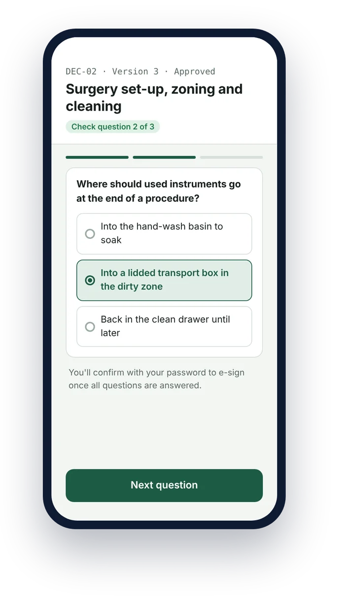 A dental nurse answering a decontamination check question before e-signing the SOP on a phone